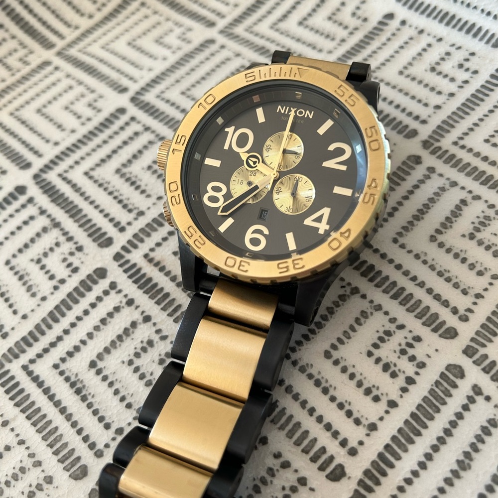 Nixon 51-30 wristwatch, gunmetal and gold stainless steel.